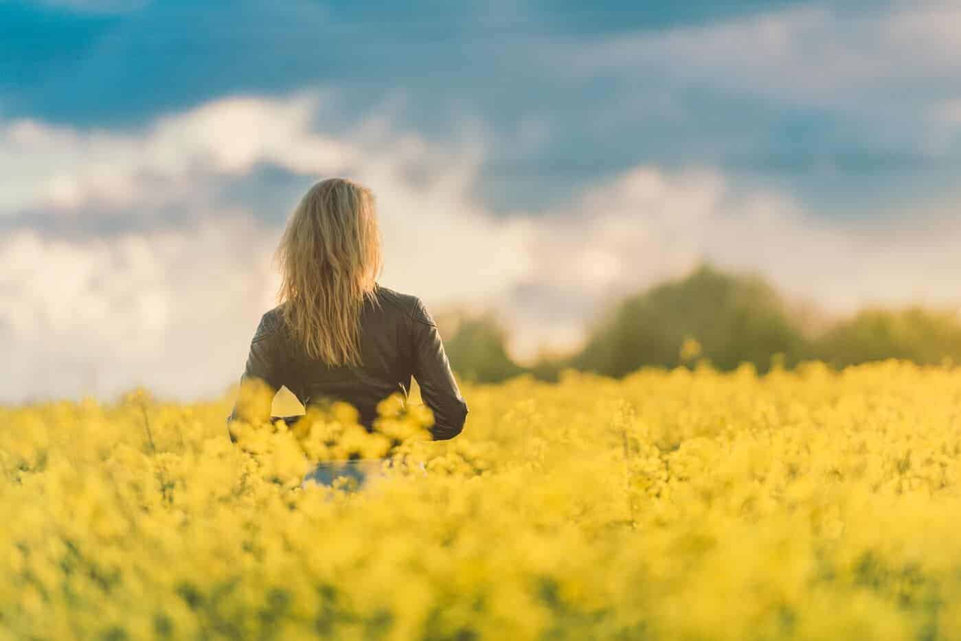 woman in yellow field at sunset resize